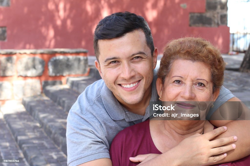 Mother and son smiling outdoors Mother and son smiling outdoors. Family Stock Photo