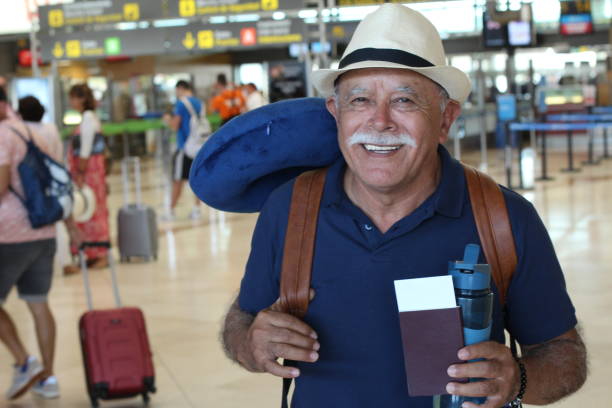 istock Senior traveler holding his passport 1187855808