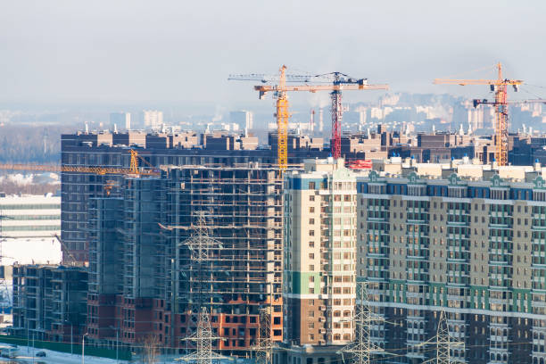 istock Winter construction work site high-rise appartment buildins with many cranes 1187857203