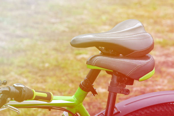 istock two bicycles are leaning their seats against each other 1187859528