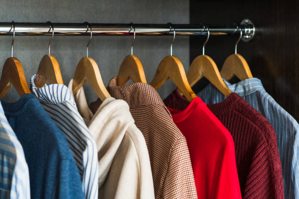 Different Clothes On Hangers. Shopping concept.