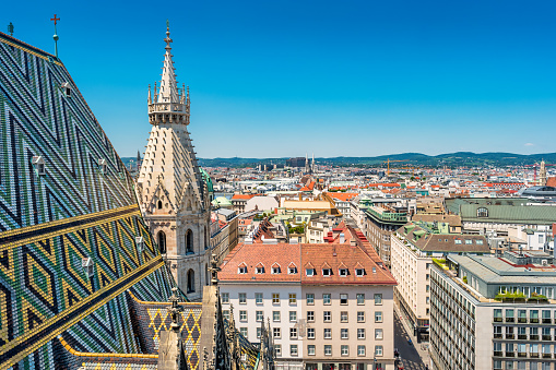 Stock photograph of Stephansdom aka St. Stephen's Cathedral and cityscape of downtown Vienna Austria on a clear sunny day.