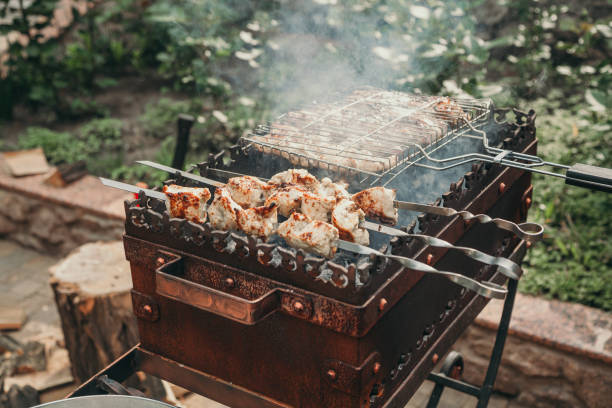 istock Appetizing kebab and barbecue net lies on forged barbecue 1187861973