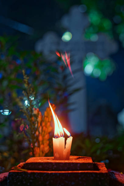 Remembering all those loved ones who have departed this world ... Christians celebrate All Souls Day in Lower Circular Road cemetery, offering flower, candle sticks, diyas, incense sticks etc.Photo taken at Kolkata on 11/02/2019.
