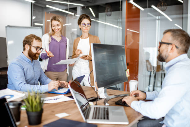 istock Office work with diverse coworkers 1187869360