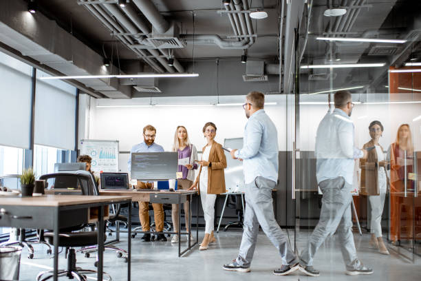 istock People working in the modern office 1187869655