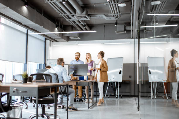 istock People working in the modern office 1187869697