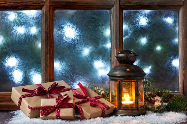 istock Winter  frost window with burning lantern, Christmas  or Advent 1187870610