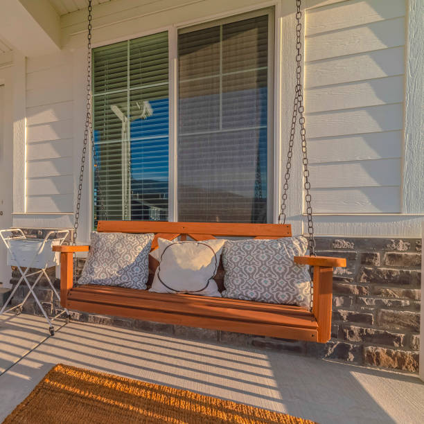 istock Square frame Front veranda of modern home with swinging chair 1187871184