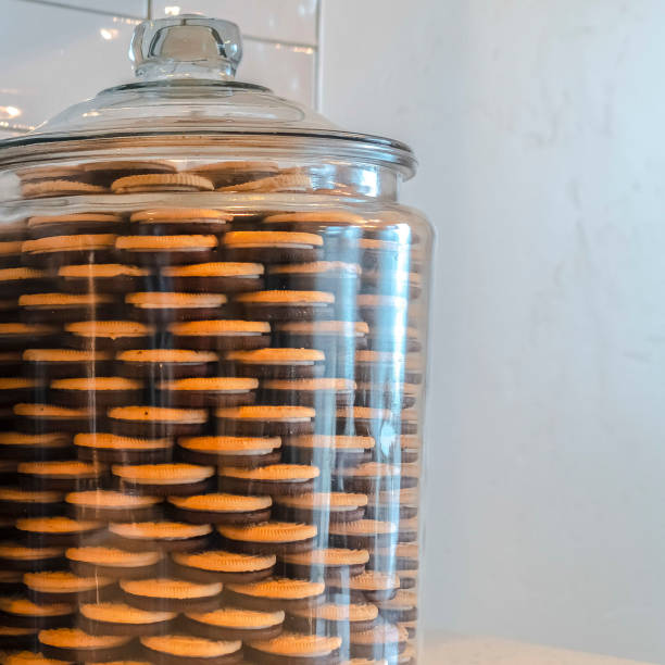 istock Square Two large glass storage jars filled with cookies 1187873963