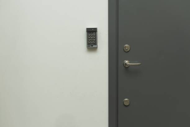 istock Close up view of grey metal door with digital code lock to the left. Security concept, 1187876005