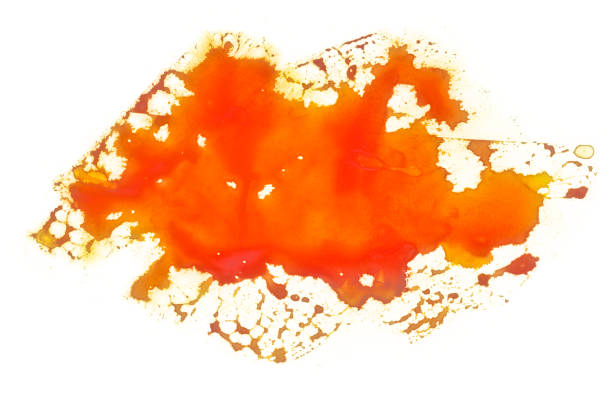 orange stain watercolor splashing droplets on a white background