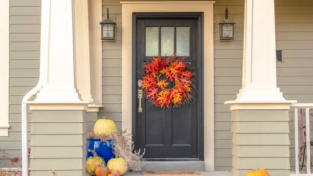 istock Panorama frame Autumn decorations and colorful wreath at sunset 1187876517