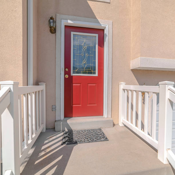 istock Square frame Red front door and steps of traditional home 1187878785