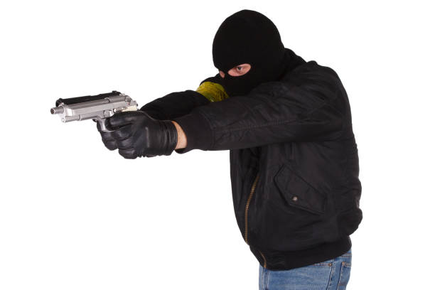 istock Criminal with handguns isolated on white background 1187878872