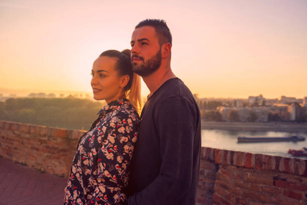 istock romantic couple enjoys at the sunset 1187879662