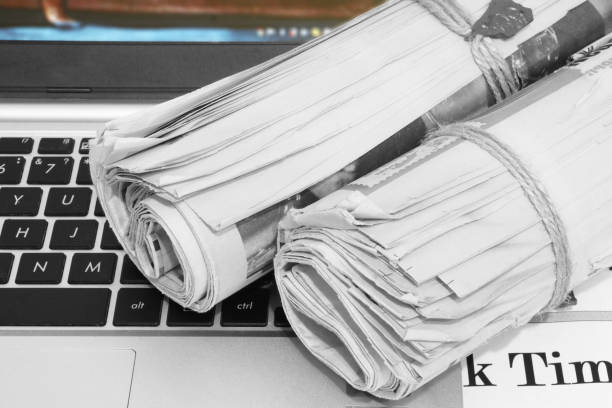 istock Newspapers and Laptop 1187880819