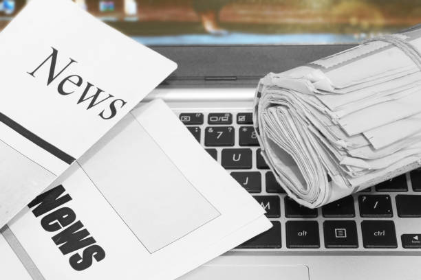 istock Newspapers and Laptop 1187880823