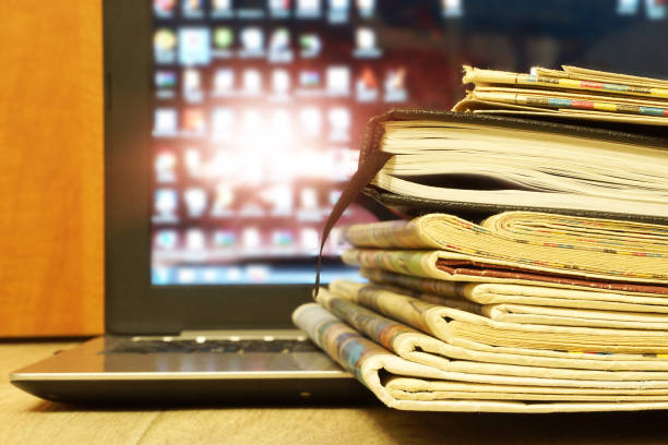 istock Newspapers, Laptop and Business Diary 1187880875