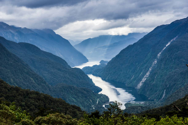 Wilmot Pass Doubtful Sound Fjord Valley Fiord South Island New Zealand A stunning view of Doubtful Sound in Fiordland, South Island New Zealand from Wilmot Pass in April milford sound photos stock pictures, royalty-free photos & images