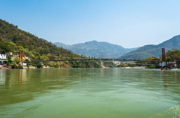 istock Ram Jhula bridge over Ganga River from a boat at Rishikesh. India 1187885998