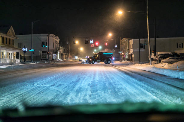 snowplow dump truck orka w late night village center - street name sign small town america street street light zdjęcia i obrazy z banku zdjęć