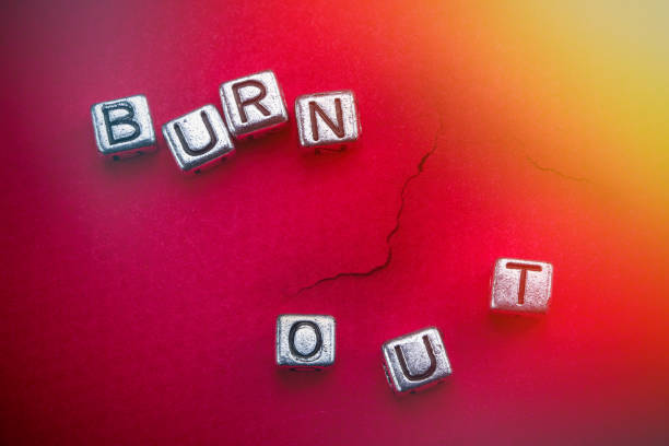 istock Burnout background concept with cubic metal letters 1187889219