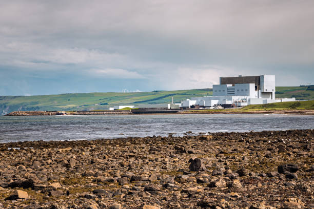 istock Nuclear power station along a coast and cloudy sky 1187889375