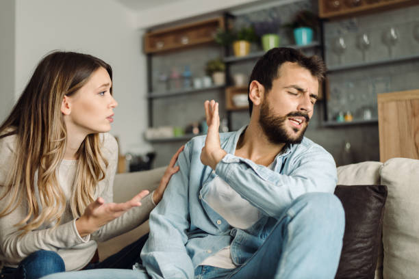istock Young angry man having relationship difficulties with his girlfriend 1187890976