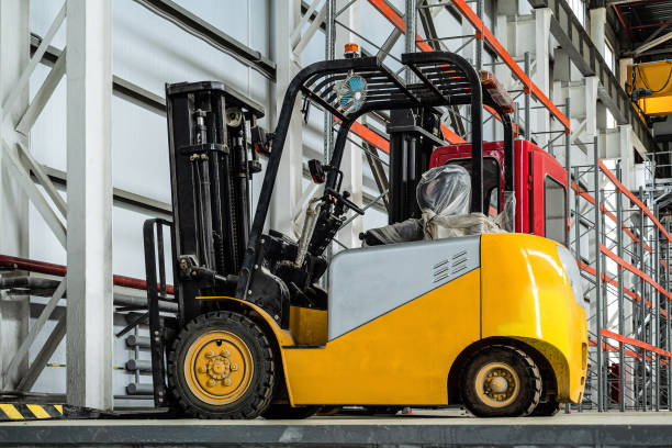 istock Compact forklift truck in a industrial warehouse building 1187891856