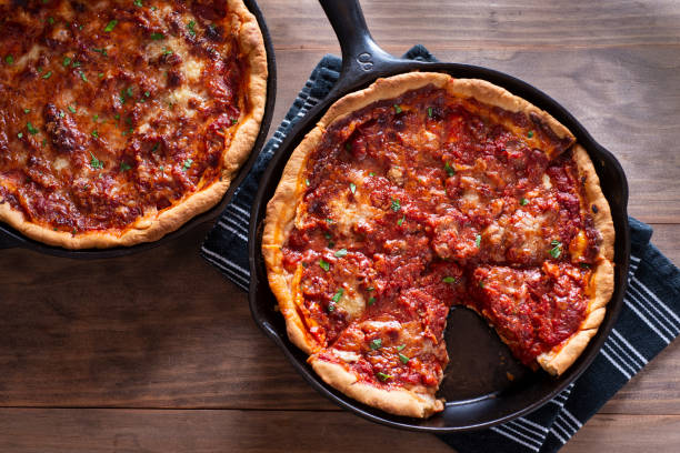 Deep Dish Pizza Deep Dish Chicago Style Pizza in a Cast Iron Skillets skillet cooking pan photos stock pictures, royalty-free photos & images