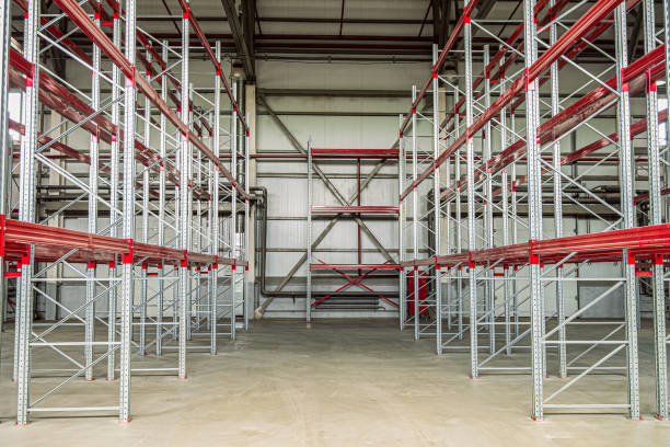 istock Empty industrial warehouse building with rows of racks. Warehouse passage. 1187892117