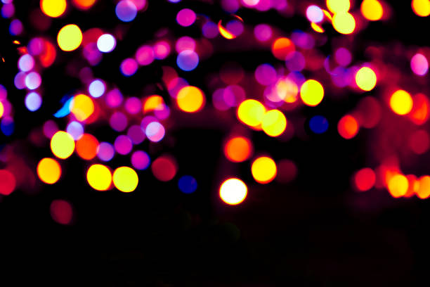 istock Colorful circles bokeh festive glitter dark background 1187892736