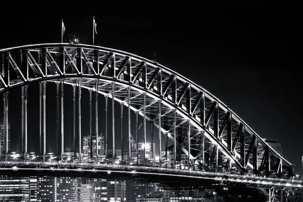 istock Sydney Harbour Bridge at night, black and white, background with copy space 1187892783