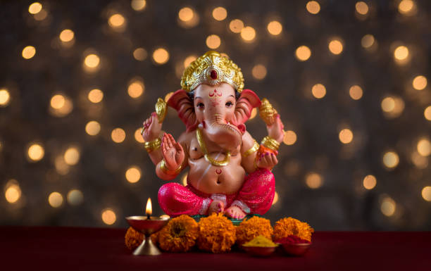Hindu God Ganesha on Blured bokeh background, Ganesha Idol. stock photo