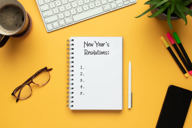 istock 2020 new year notebook with list of resolutions and objects 1187898858