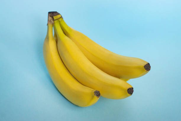 istock Banana isolated on blue background 1187900302