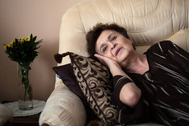 istock Older woman resting her head 1187907464