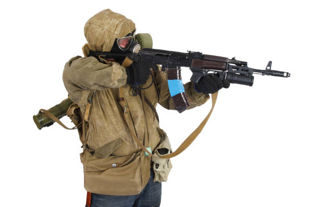 istock Stalker in gas mask with ak-47 gun isolated on white 1187907817