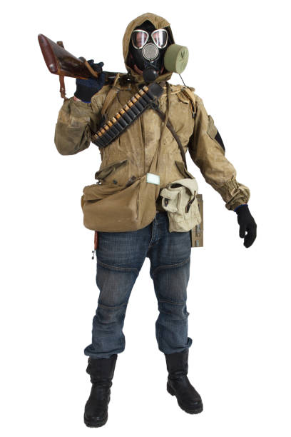 istock Stalker in gas mask with gun isolated on white 1187908339