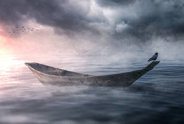 Boat drifting and lost in the ocean stock photo