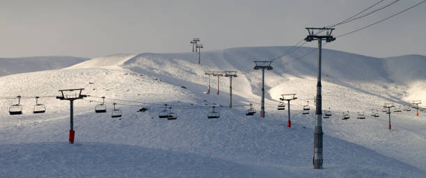 istock Ski slope with chair-lift in evening 1187911100