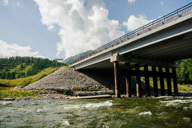 istock Concrete bridge over mountain small river in sunny day. 1187911123