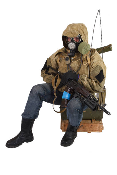 istock Stalker in gas mask with weapon 1187916234