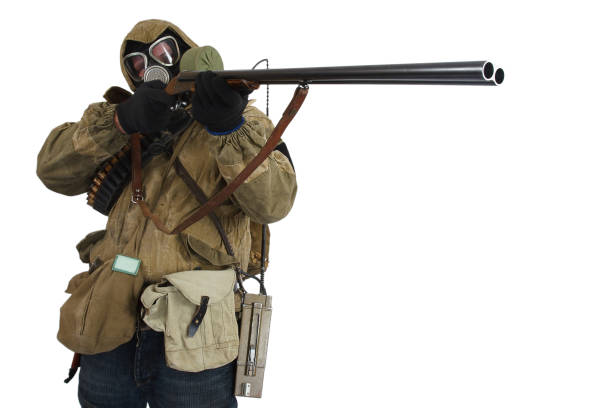 istock Stalker in gas mask with weapon 1187916766