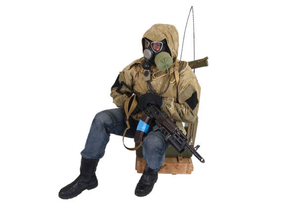 istock Stalker in gas mask with weapon 1187917283