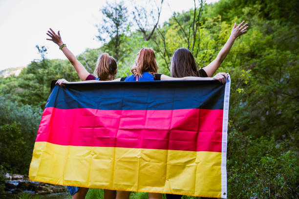 istock Friends holding German flag in nature 1187917895