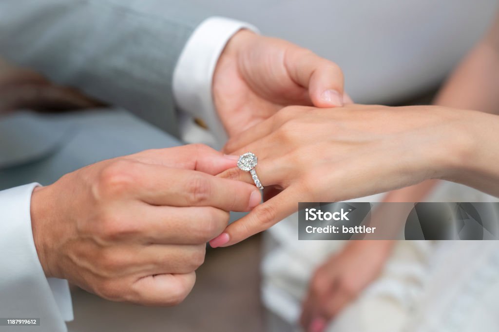 Commitment Wearing a ring at the engagement ceremony Engagement Ring Stock Photo