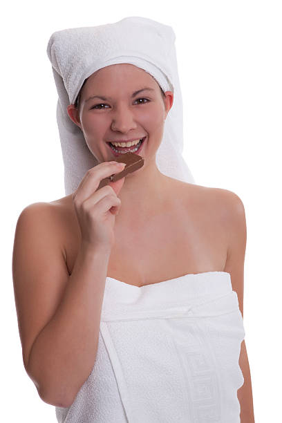 istock Young woman eating chocolate 118792013