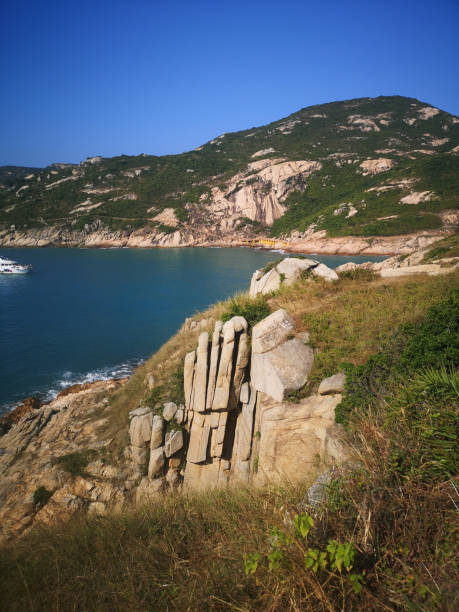 istock Palm Cliff, a hand-shaped feature carved into the face of a cliff by the elements, which is one of the most recognisable landmarks of Po Toi Island, Hong Kong 1187923033